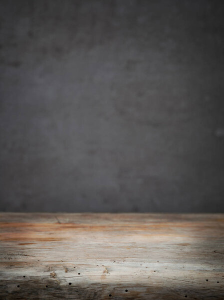 Wooden table and grey wall background