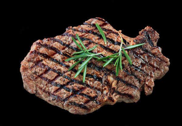 Grilled beef steak meat isolated on black background
