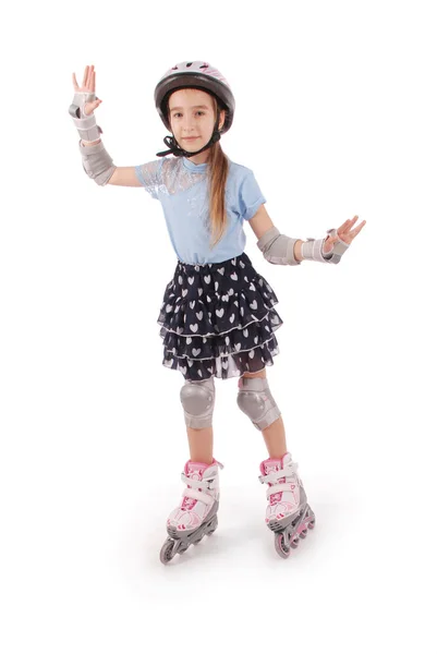 Malá Hezká Dívka Kolečkových Bruslích Proti Bílým Pozadím — Stock fotografie