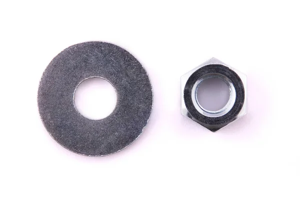 Flat metal washers and nut isolated on a white background