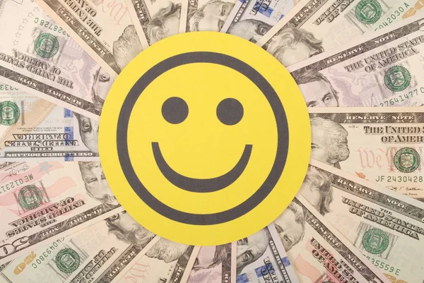 Yellow smile faces on mandala kaleidoscope from money. Abstract money background raster pattern repeat mandala circle.