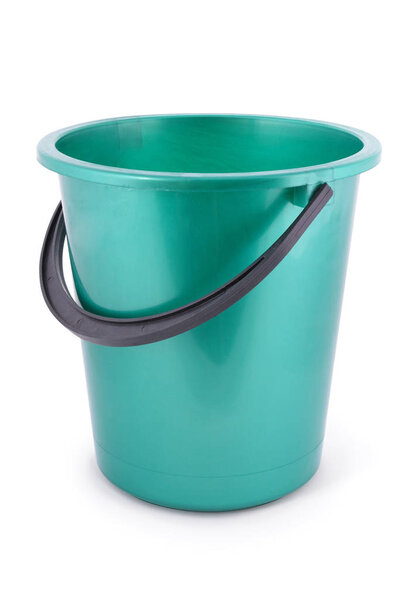 Green plastic bucket isolated on a white background