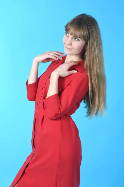 Beautiful young woman in red dress — Stock Photo, Image