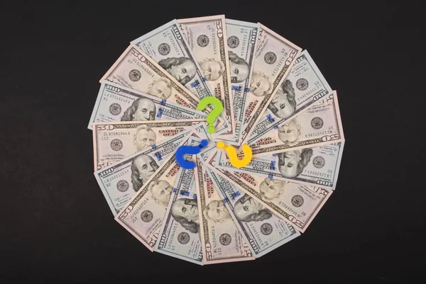 Question mark on mandala kaleidoscope from money.