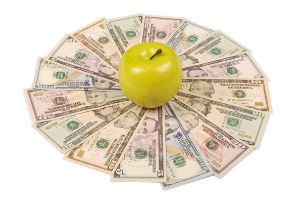 Зеленое яблоко на мандале калейдоскоп из денег . — стоковое фото