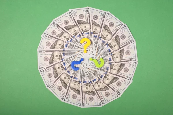 Question mark on mandala kaleidoscope from money.