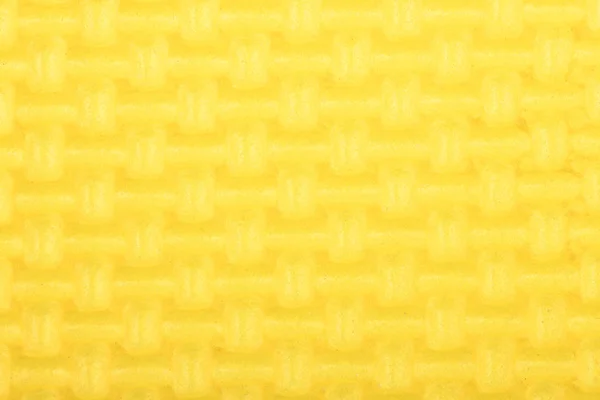 Textur einer Polyethylen-gelben glänzenden Turnmatte. Textur der Yogamatte. — Stockfoto