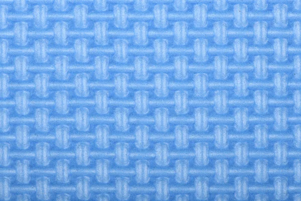 Textura de una estera de gimnasio de polietileno brillo azul. Textura de esterilla de yoga . — Foto de Stock