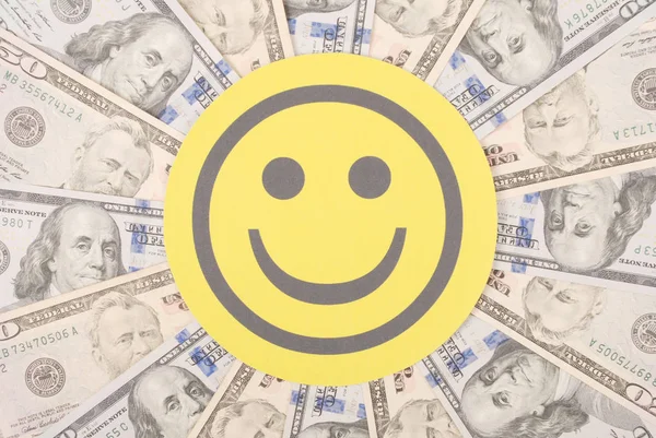 Smile faces on mandala kaleidoscope from money. — Stock Photo, Image