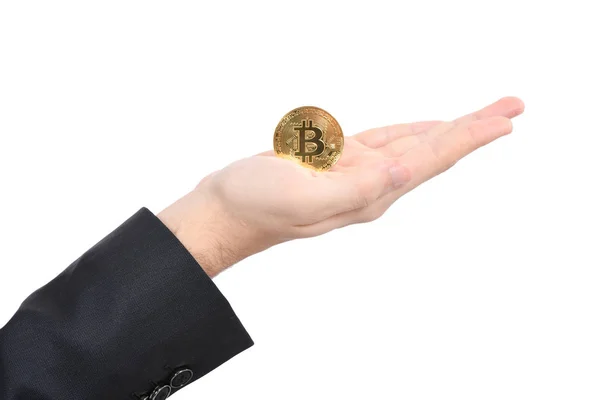 Mano del hombre sosteniendo Bitcoin oro sobre fondo blanco . — Foto de Stock