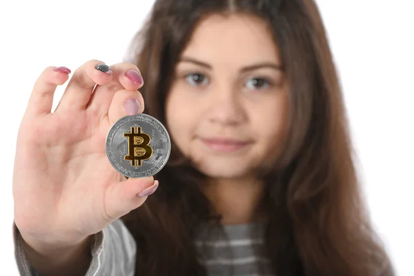 Niña sosteniendo criptomoneda — Foto de Stock