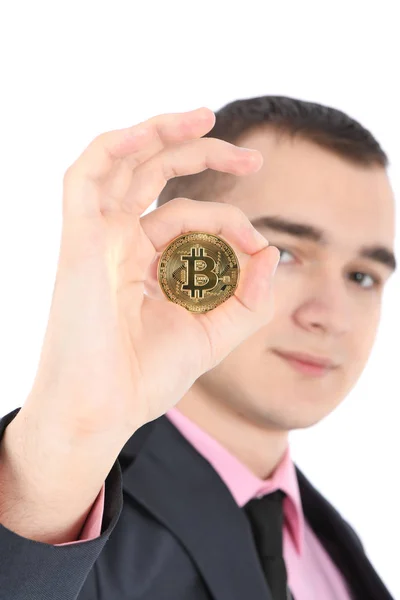 Homem segurando Bitcoin dourado isolado em branco — Fotografia de Stock