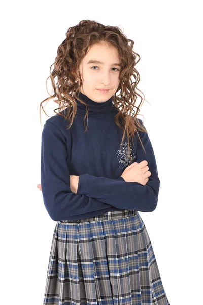 Портрет чарівної усміхненої дівчини дитячої школярки з завитими волоссям — стокове фото