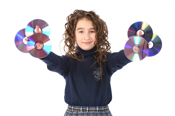 A młody uczennica z curl włosy Holding CD lub DVD. — Zdjęcie stockowe