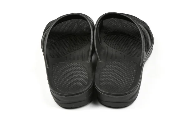 Zapatillas de goma. Pareja de chanclas negras aisladas sobre un blanco . —  Fotos de Stock