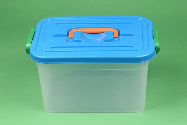 Food plastic box isolated on green.