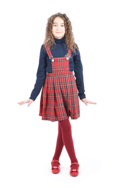 Retrato de adorable colegiala sonriente con el pelo rizado de pie aislado en un blanco — Foto de Stock