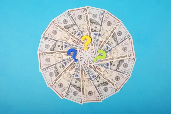 Question mark on kaleidoscope from money. — Stock Photo, Image