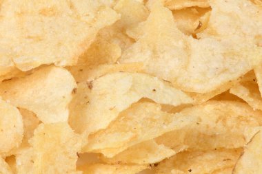 Patates cipsi dokusu arka plan düz tepeden görünüyor. Yüksek çözünürlüklü. Tam alan derinliği.