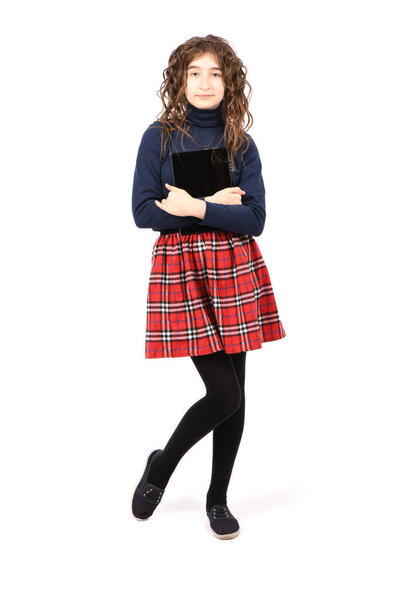 Pretty curly young girl smile and showing tablet pc isolated on white background. High resolution photo. Full depth of field.