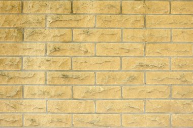 Yeni ve Temiz Sarı Tuğla Duvarı. Yüksek çözünürlüklü. Tam alan derinliği (DOF).