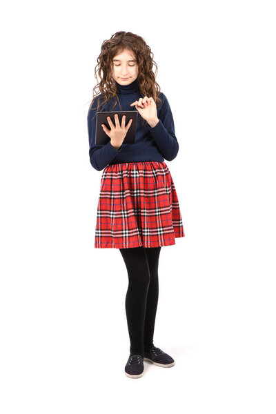 Pretty curly young girl smile and showing tablet pc isolated on white background. High resolution photo. Full depth of field.