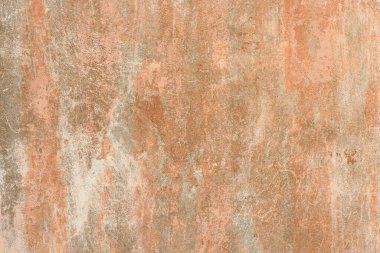 Eski antik sokak duvarı tozlu ve çizilmiş grunge desenli boya lekeleri, çatlaklar, gri-turuncu duvar arka planında çizikler. Yüksek çözünürlüklü. Tam alan derinliği (DOF).