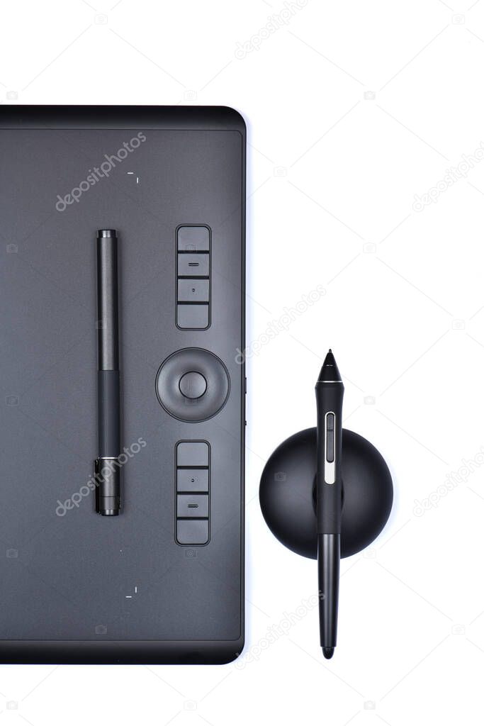 Top view professional graphics tablet with digitized pen. Isolated on white background. High resolution photo. Full depth of field.