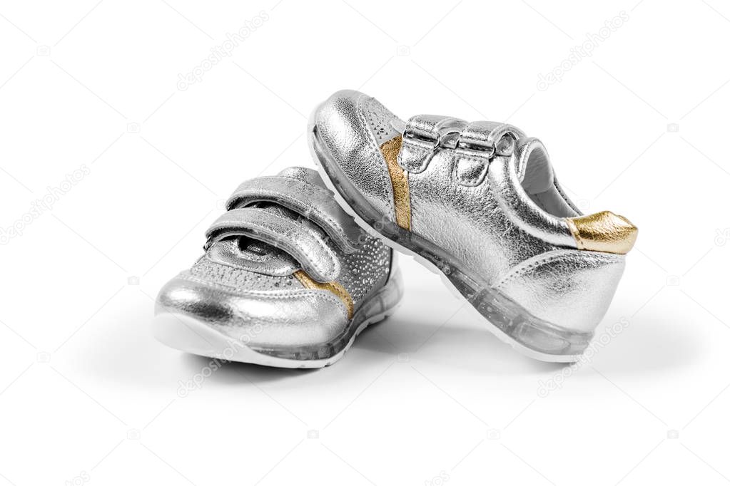 flat lay. the silver children's sports shoes isolated on a white background