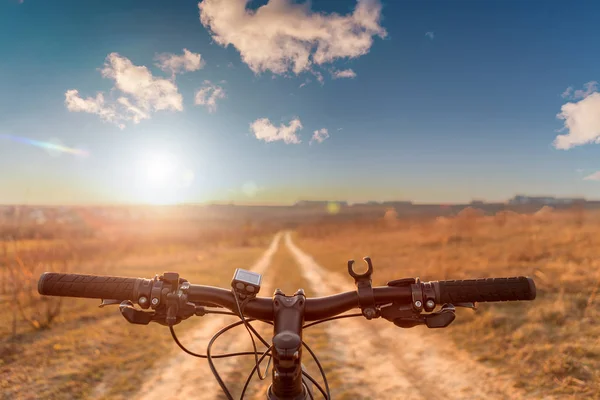 Bicycle on the field road — Stock Photo, Image