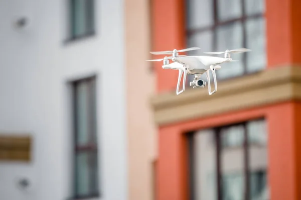 Drone quad copter with camera spying on the house