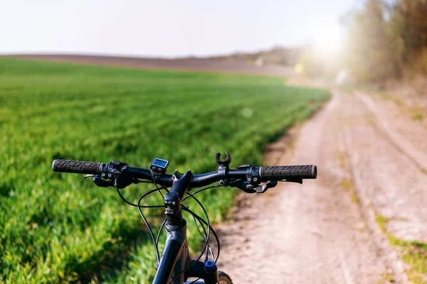 Bicycle on the field road — Stock Photo, Image