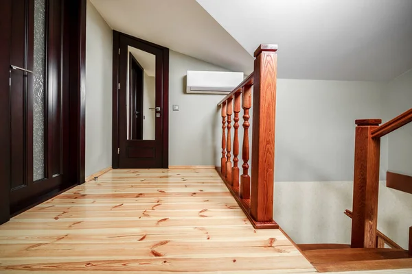 Interior of house: corridor, wood staircase