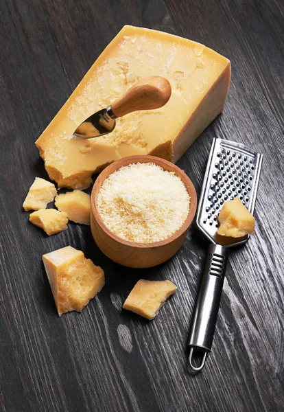 Parmesan cheese on wooden board — Stock Photo, Image