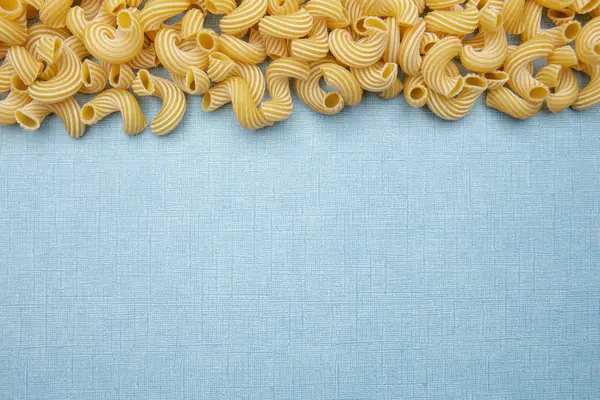 Pasta Penne Rigate Blue Background Raw Ingredient Cooking — Stock Photo, Image