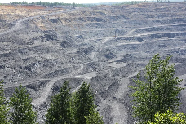 Landscape with the pit thrown coal. Extraction of rare-earth metals in the open way.