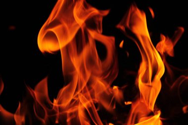 Bulanık arka plan. Siyah üzerinde yangın alevleri desen.