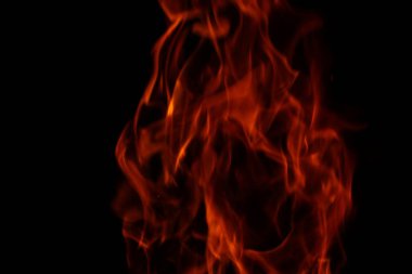 Bulanık arka plan. Siyah üzerinde yangın alevleri desen.