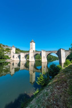 Pont Valentre, a 14th-century six-span fortified stone arch bridge crossing the Lot River to the west of Cahors in Lot, Midi-Pyrenees, France. clipart