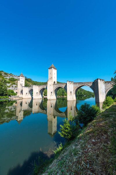 Pont Valentre, a 14th-century six-span fortified stone arch bridge crossing the Lot River to the west of Cahors in Lot, Midi-Pyrenees, France.