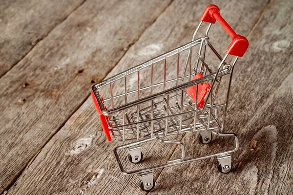 Empty Shopping Trolley Wooden Background — Stock Photo, Image