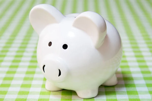 White Piggy Bank Table Checkered Tablecloth — Stock Photo, Image