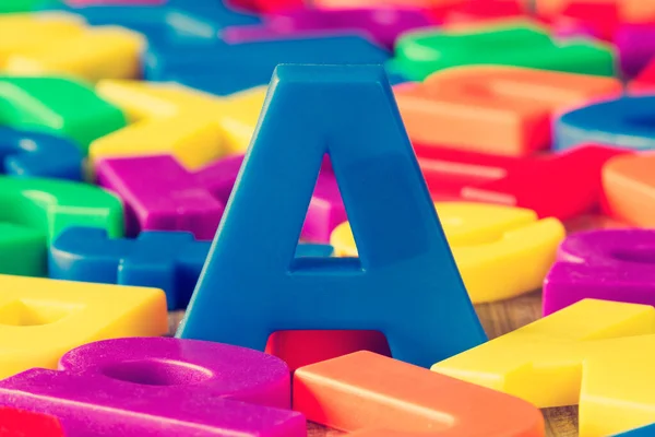 Blue Letter Pile Other Colorful Plastic Letters — Stock Photo, Image