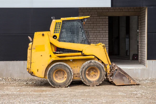 Bobcat Amarillo Cargador Deslizamiento Sitio Construcción — Foto de Stock