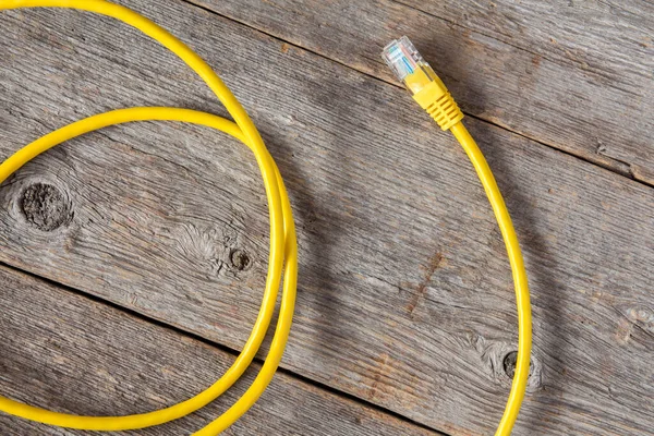 Yellow Internet Cable Old Wooden Background — Stock Photo, Image