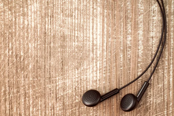 Auriculares Negros Sobre Fondo Madera Con Espacio Para Copiar —  Fotos de Stock