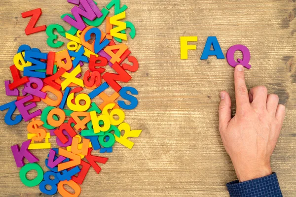 Hand Arrange Plastic Letters Faq Abbreviation Frequently Asked Questions — Stock Photo, Image
