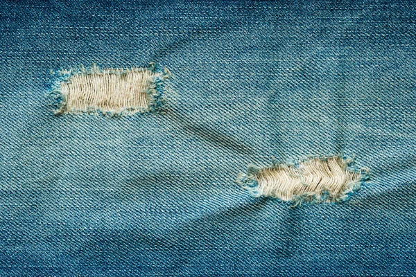 Trou Déchiré Sur Fond Jeans Bleus Gros Plan Texture Jeans — Photo