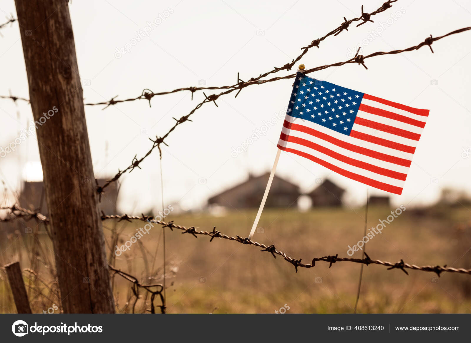 American Flag Old Barbed Wire Fence Blurred Buildings Background Stock