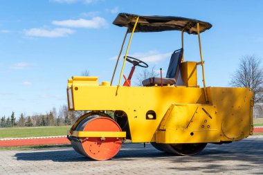 Small roller for a grass pushing on the playing field clipart